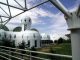 Scientific Illustration of Biosphere 2 - a photograph of the facility as it was in 2003, 20 years after the experiment.