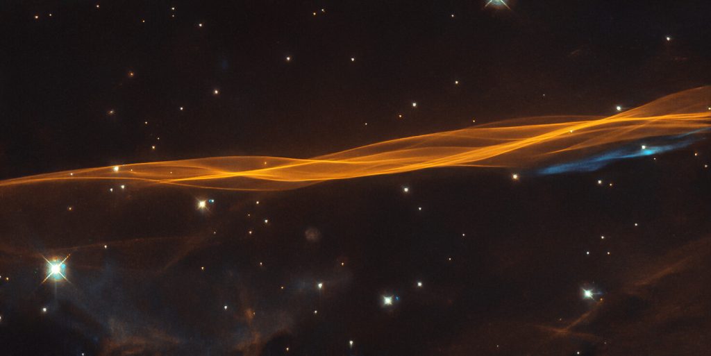 Scientific illustration from the Hubble Space Telescope of a shockwave in space - a small section of the Cygnus supernova.