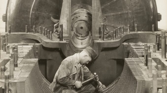 Scientific illustration of a worker manufacturing (or repairing) a gigantic Westinghouse engine (or generator).