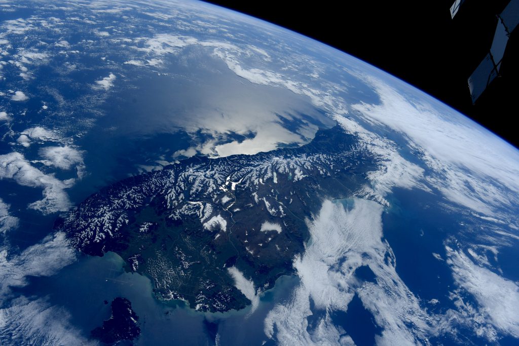Scientific illustration of the Earth in the form of a photograph of New Zealand by the International Space Station's Samantha Cristoforetti.