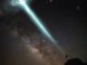 Scientific illustration of a telescope array capturing a gamma-ray burst: dark skies and glowing energy fields. Superbossa.com and C. Righi.