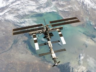 Scientific illustration of the International Space Station, orbiting high above the Caspian Sea, as photographed by Space Shuttle Discovery.