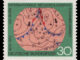 Scientific illustration of a meteorological diagram on a postage stamp. Looping black lines of atmospheric pressure mark an area where a warm front moves northeast where two cold fronts converge heading south.