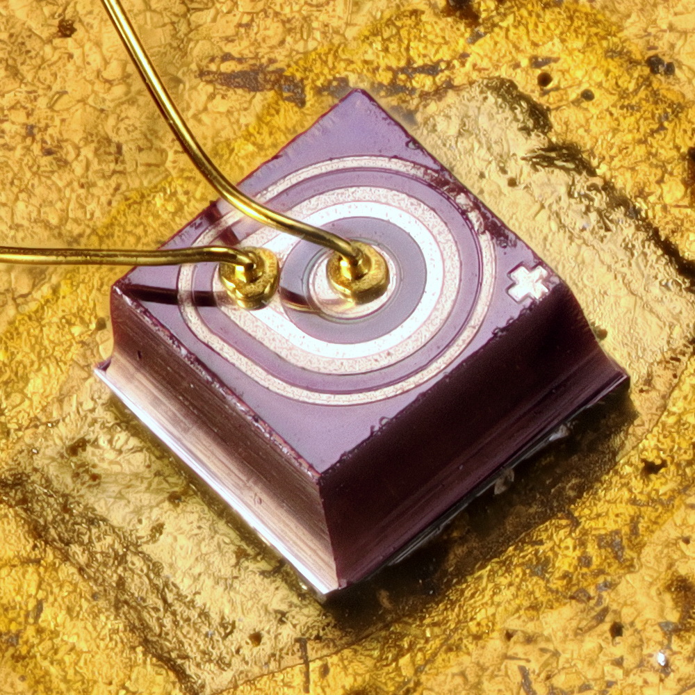 Scientific illustration of an electronic component, a photograph of a transistor enlarged.
