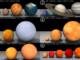 Scientific illustration comparing the sizes of planets and stars - how much bigger Jupiter is than Earth, or the Sun than Jupiter, or Sirius than the Sun.