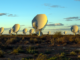 Scientific illustrations of rows of radio telescopes