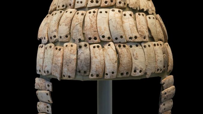 Scientific illustration of an ancient Greek helmet.