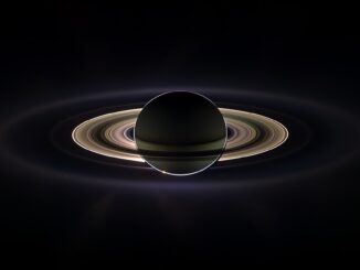 Scientific illustration of Saturn eclipsing the sun, a dramatic image of the ringed planet backlit in space.