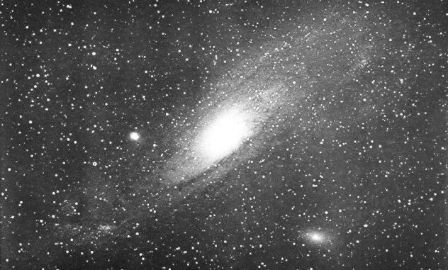 Scientific illustration of the "Great Nebula of Andromeda," which we now know as the Andromeda galaxy (with two more galaxies in the frame too).