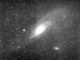 Scientific illustration of the "Great Nebula of Andromeda," which we now know as the Andromeda galaxy (with two more galaxies in the frame too).