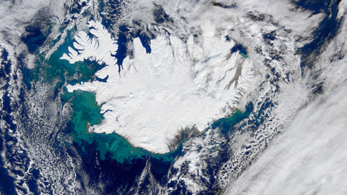 Scientific illustration of the surface of the Earth; a colorful satellite picture of stark-white Iceland in the blue-green North Atlantic.