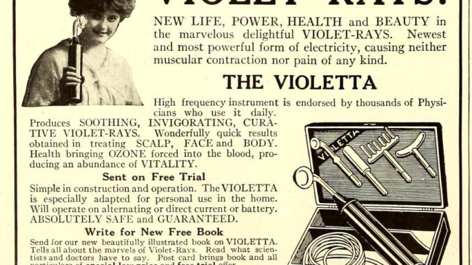 A woman with short, bushy hair holds a cylindrical device and smiles next to a headline shouting VIOLET-RAYS! above a scientific illustration of a case of electric equipment that promises SOOTHING, INVIGORATING, CURATIVE VIOLET-RAYS, which are ABSOLUTELY SAFE and GUARANTEED.